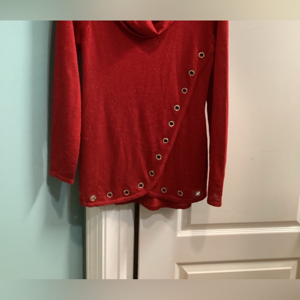 Red knit top.
